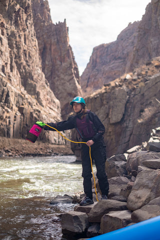 Setting safety with a hot pink River Station Throw Bag. 