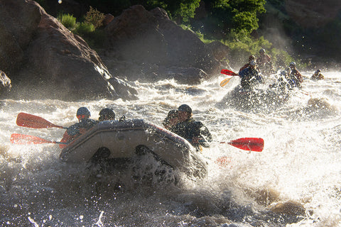 Highwater rafting with river station throw bag company.