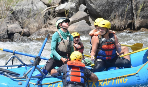 Raft guide saving a swimmer on the Arkansas River in Colorado.