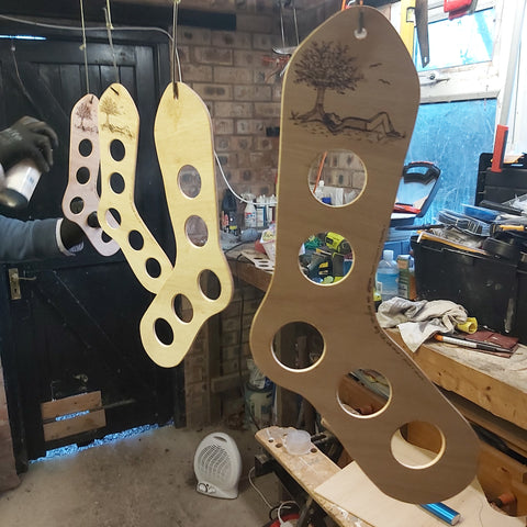 Sock blockers being varnished