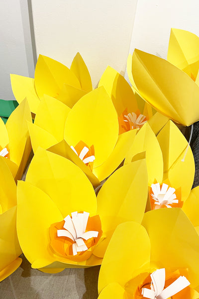 A group of handmade paper daffodils, ready to be installed at Broadway Shopping Centre