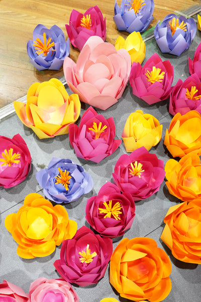 Custom-made paper flowers ready to install, in varying colours