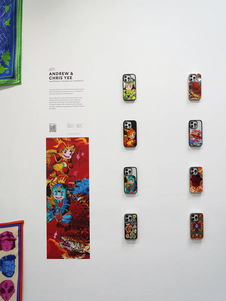Artwork and custom phone cases from Chris and Andrew Yee's collaborative exhibition Cosmic Neighbour