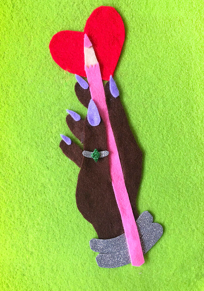 Gorgeous handmade felt illustration made by Kitiya Palaskas, with felt cutouts of a hand holding a pen. The illustration is colourful and eyecatching