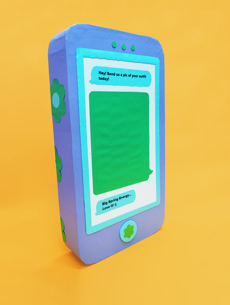 A giant phone prop in pastel colours, made by Kitiya Palaskas