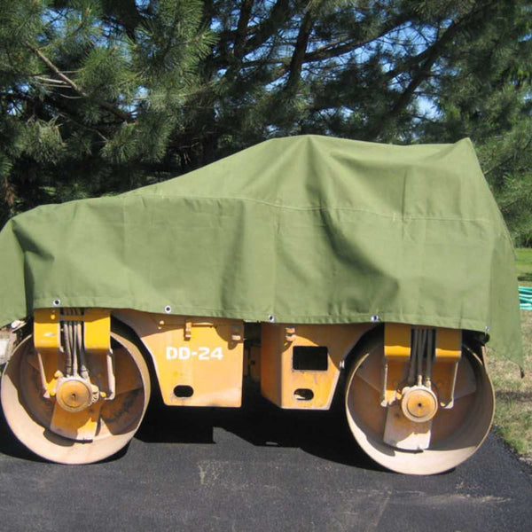 Green polyester canvas tarp used to cover construction machinery