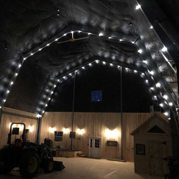 12 Mil Super Heavy Duty Silver/Black Tarp used as a custom canopy in a barn roof