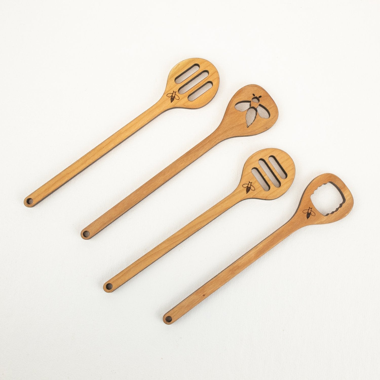 https://cdn.shopify.com/s/files/1/0641/8743/3181/products/wooden-honey-dipper-spoon-with-cutout-pattern-297192_1600x1600_crop_center.jpg?v=1695957713