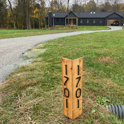 house number signs for a long driveway don't have to be large or expensive. They can be a simple sign at the road.