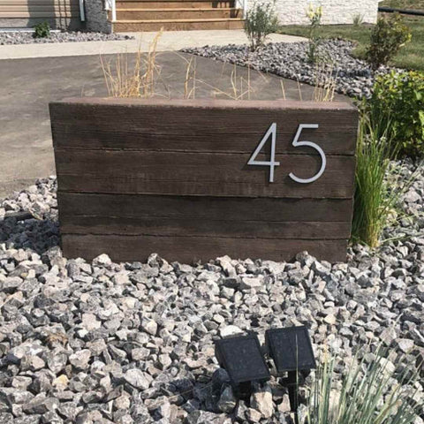 front yard landscaping ideas that include an address sign