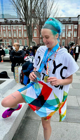 Ally celebrating at the Tokyo marathon