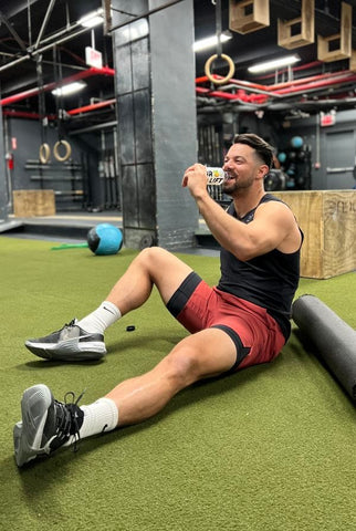 A man resting while drinking PWR lift