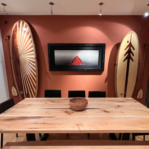 Ventana wooden paddle boards in a dining room at a lake house