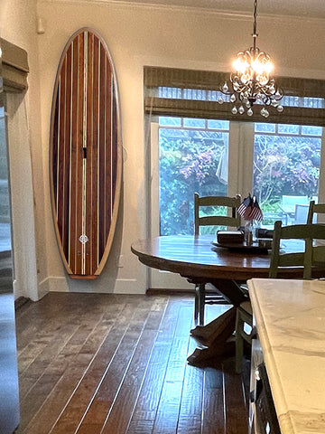 Ventana wooden paddle board in a home