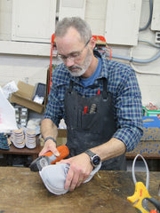 Ralph Baker, Jr. C. Ped. preparing a shoe for a custom buildup