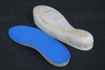 Image depicting a Plaster of Paris casting of an individual foot and it's complimenting custom orthotic