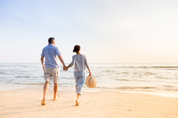 couple walking down the beach