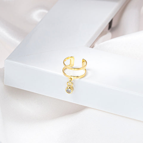 gold cuff earring with cz tiny charm on the white frame