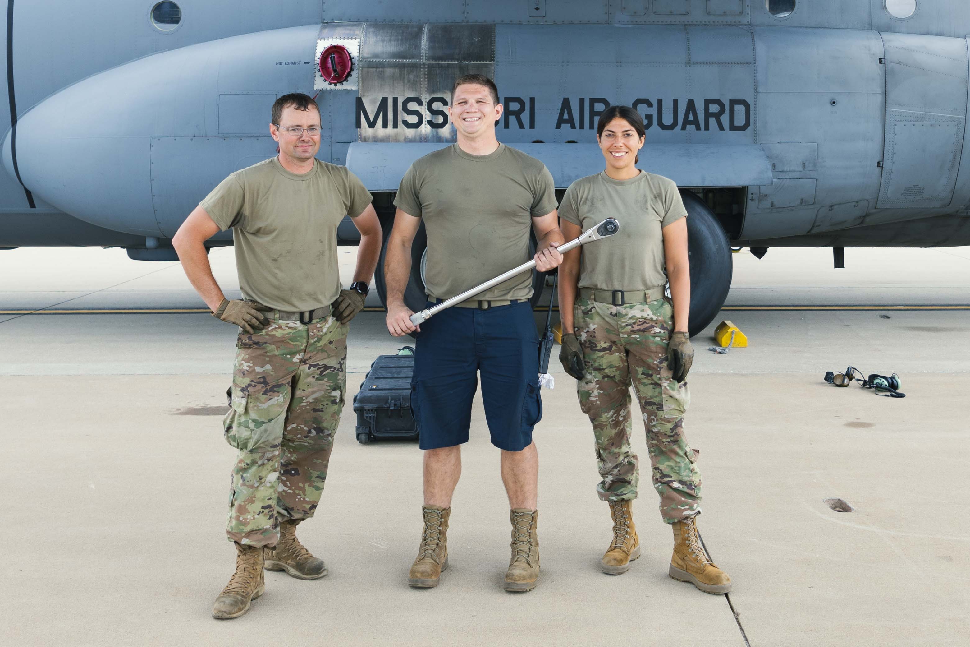 Airmen from the Missouri Air National Guard pause during aircraft repairs.