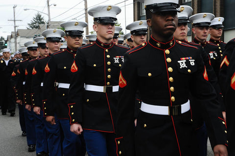 Marines in Class A Dress Uniforms marching in a line