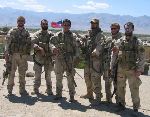 Six US Navy SEALs in combat gear including Marcus Luttrell