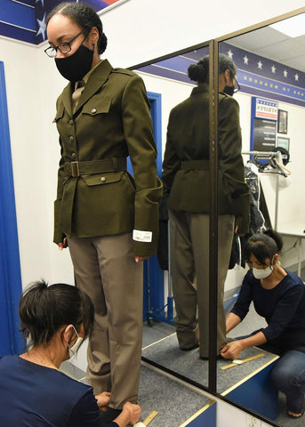 Female Army soldier getting new AGSU Uniform tailored