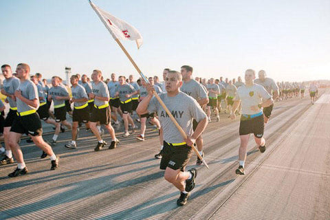 Army soldiers in PT gear running in formation