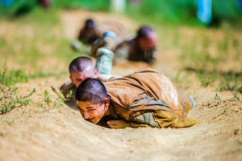 recruit crawling on belly through dirt