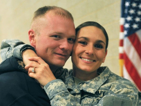 US Army female soldier hugging her husband