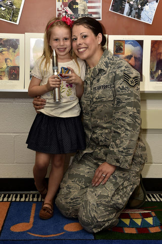 military mom gifts airman with daughter