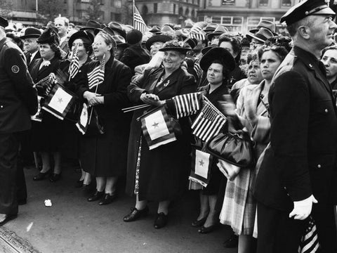 Antique photo of many women waving american flag