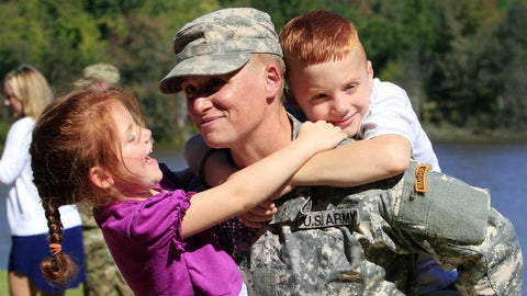 Female US Army ranger carrying kids