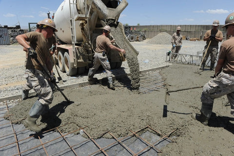 Soldiers pouring cement