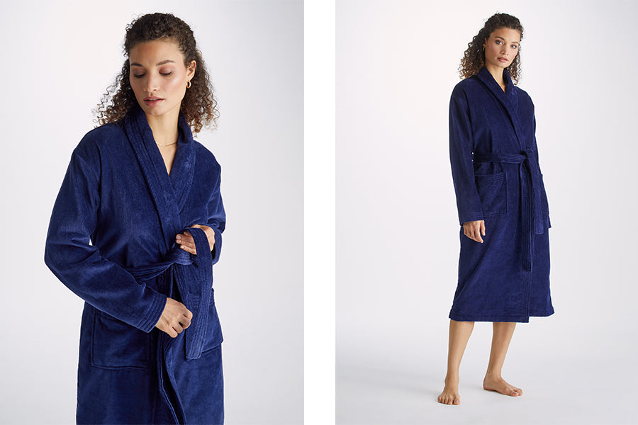 Woman in navy blue terry cotton dressing gown