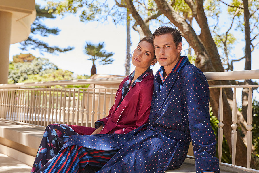 Man and woman sat in dressing gowns