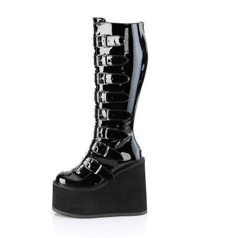 Platform Knee-High Boots with Metal Buckles.