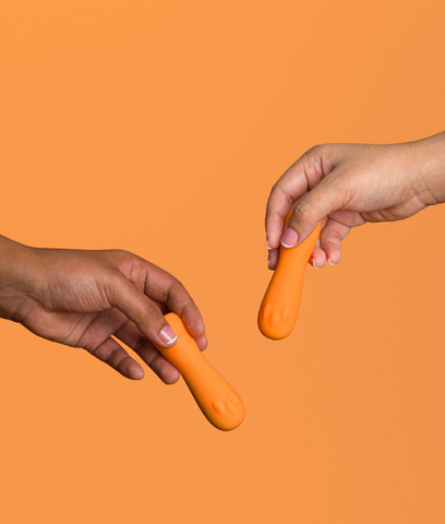 two orange bullet vibrators on orange background