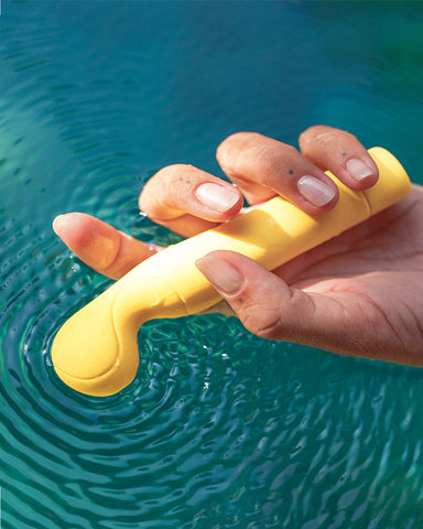 the tennis pro yellow vibrator over a pool of water