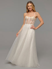 Image of a blonde woman wearing a wedding dress with a sheer bodice.