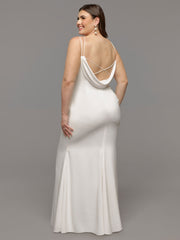 Image of brunette woman modeling the back of a plus-size backless wedding dress.