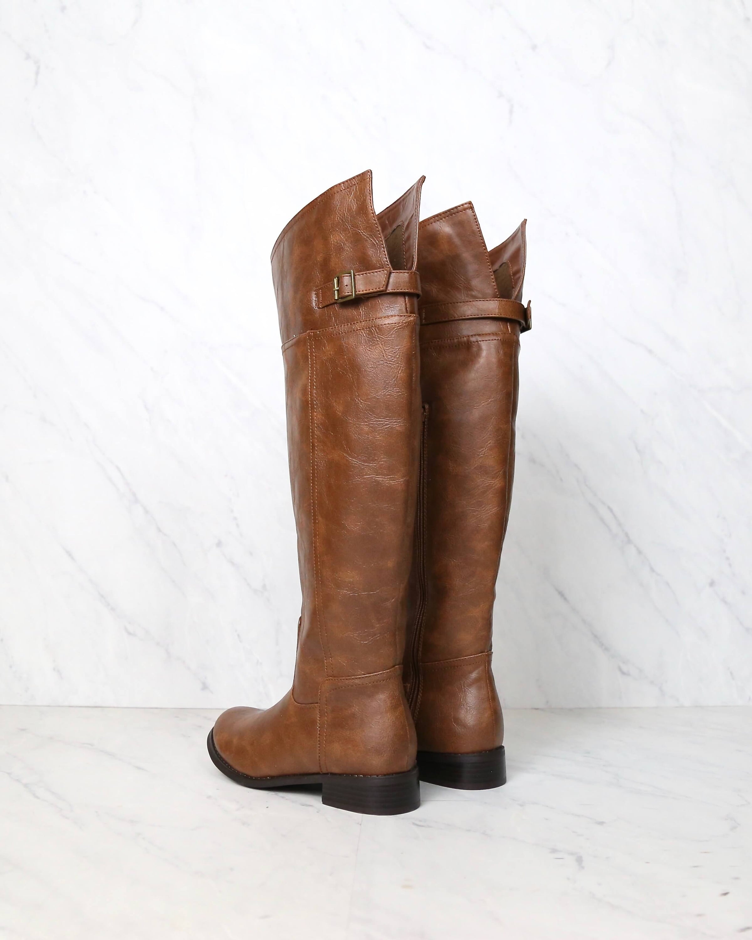 distressed riding boots