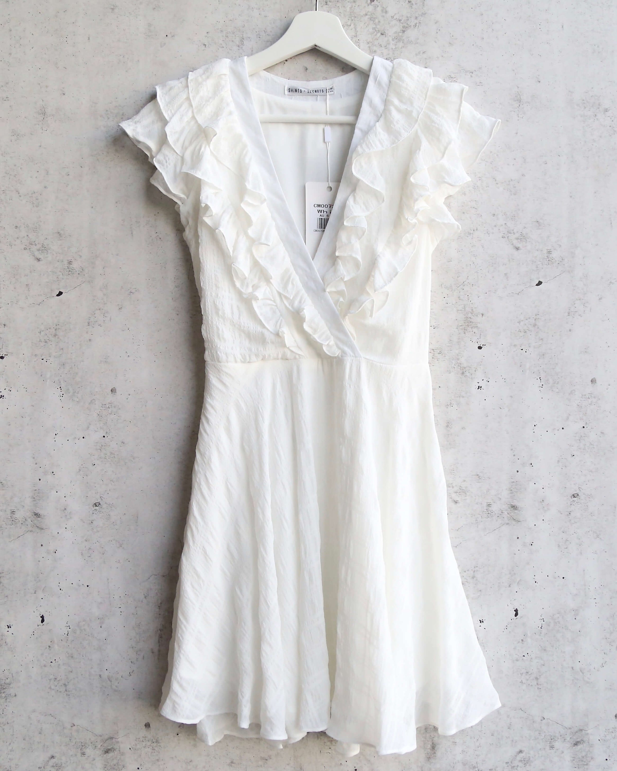 white ruffle top dress