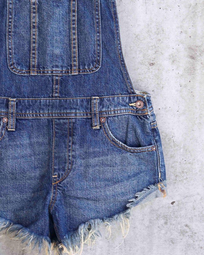 Free People - Summer Babe High Low Distressed Denim Short Overalls in ...