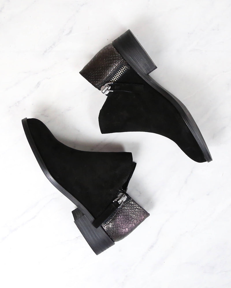 very volatile black booties