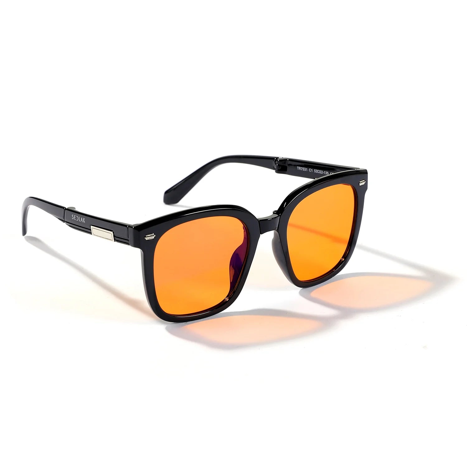 Black sunglasses with orange reflective lenses against a white background.