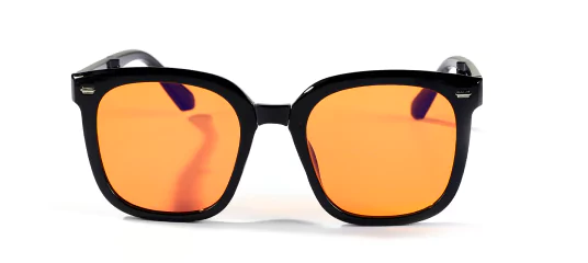 Black framed sunglasses with reflective orange lenses on a white background.
