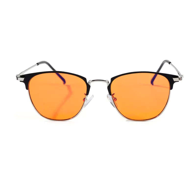 Cat-eye sunglasses with orange-tinted lenses isolated on white background.