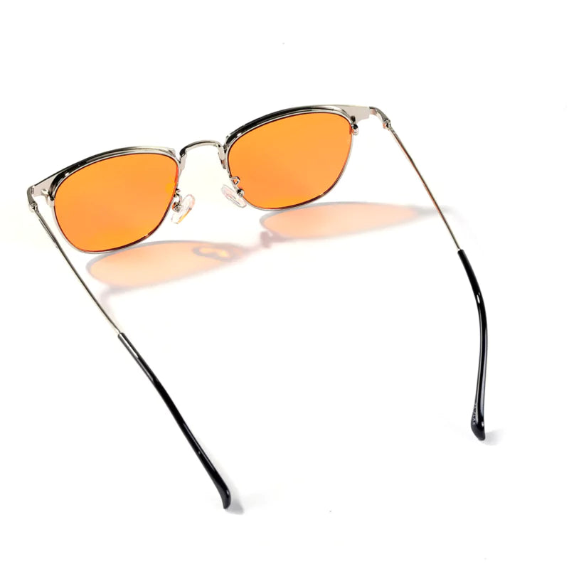 Cat-eye sunglasses with orange-tinted lenses on a white background.