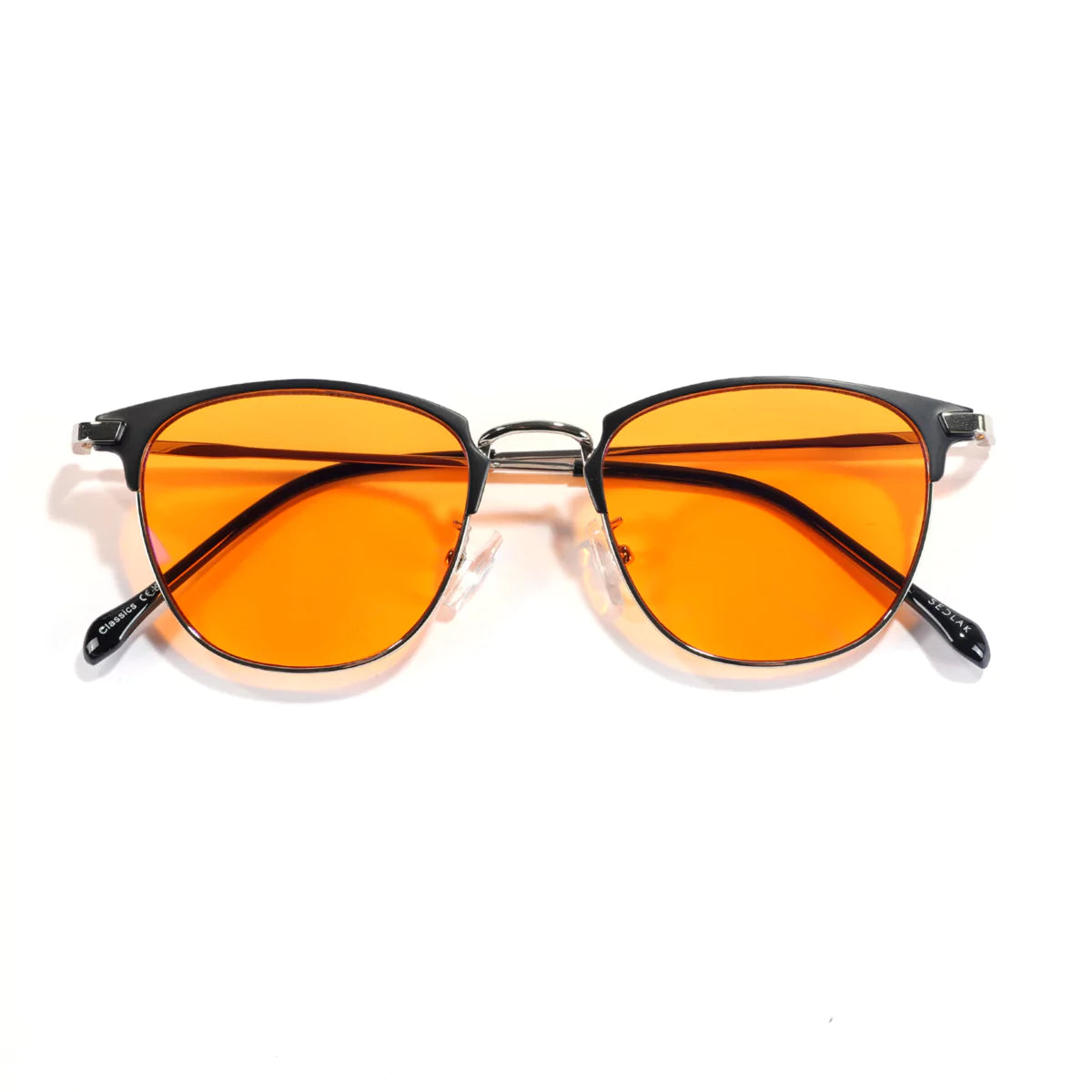 Orange-tinted aviator sunglasses on a white background.