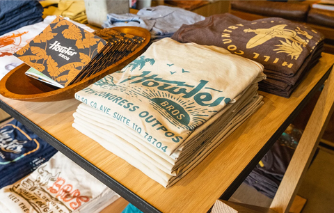 Howler Shirts On Table